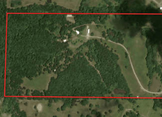 88-Acre Horse Farm with Custom Ranch Home, Stables, Ponds & Private Gated Drive